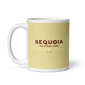 Coffee mug with an image of a giant Sequoia tree with a black bear attempting to climb it on one side and the words “Sequoia National Park, California” on the other.