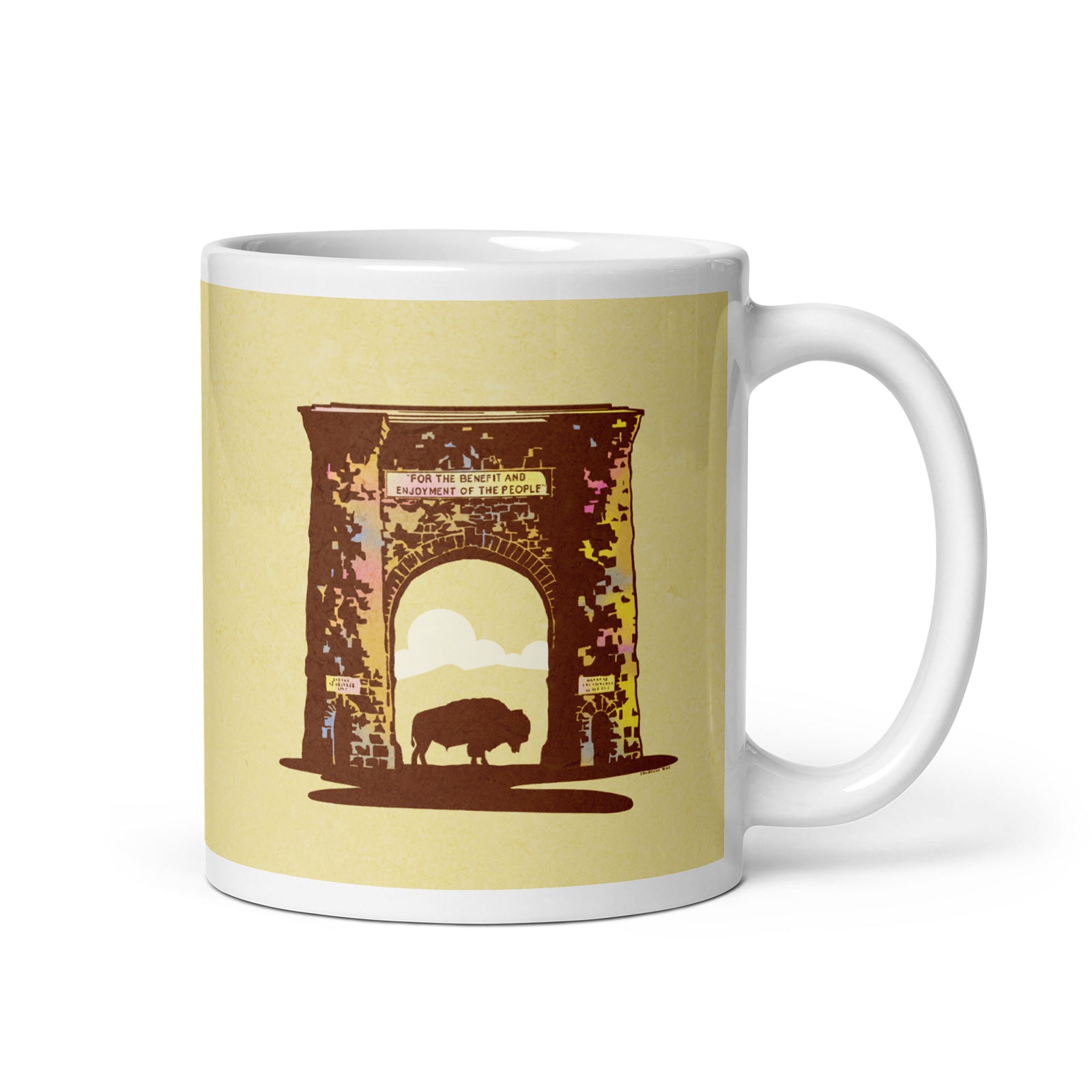 Coffee mug with an image of the historic Roosevelt Arch—a gateway to Yellowstone—with a bison standing in the middle of the entry on one side and the words “Yellowstone National Park, Idaho, Montana and Wyoming” on the other.
