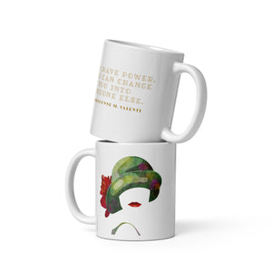 Coffee mug with a portrait of a woman’s cloche hat on one side and author Catherynne M. Valente’s quote on the other side. 