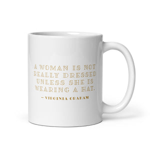 Coffee mug with a portrait of a woman’s royal wedding hat with Virginia Graham quote on the other side. 