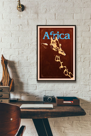 Bold graphic giclée art print of an African Giraffe. Print shows an African Giraffe blending into a dark background and overlapping the word “Africa”.