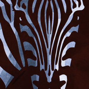 Detail of Bold graphic giclée art print of an African Zebra. Print shows an African Zebra blending into a dark background and overlapping the word “Africa”.
