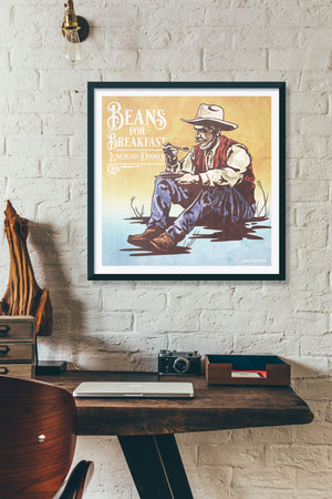 Bold graphic giclée art print of a Cowboy eating breakfast with the words “Beans for Breakfast”. Print is an ink portrait, with color, of a cowboy seated on the grounded with a plate of beans in hand. 