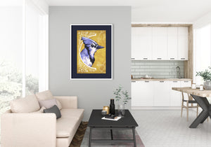 Bold graphic giclée art print of a Blue Jay. Print is a portrait of a Blue Jay next to a beautiful graphic ornament on a golden yellow background with the words “Blue Jay” below.