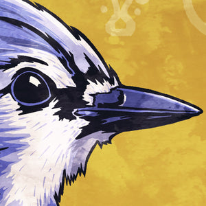 Detail of Bold graphic giclée art print of a Blue Jay. Print is a portrait of a Blue Jay next to a beautiful graphic ornament on a golden yellow background with the words “Blue Jay” below.