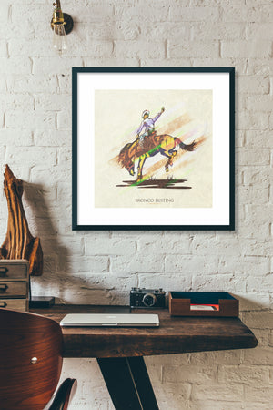 Retro styled art print of Bronco Busting. The prints depicts a cowboy riding a bronco. The bold graphic lines are complemented by colorful streaks giving the piece a sense of movement. The print has the words “Bronco Busting” on it.