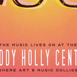 Detail of Bold graphic giclée art print of the iconic glasses and hair of Buddy Holly with the words “The Music Lives on at the Buddy Holly Center”. Print has a orange to yellow background with shades of blue.