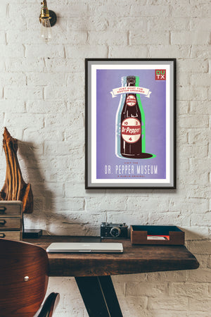 Bold graphic giclée art print of a Dr Pepper with the words “Visit the Dr Pepper Museum”. Print is predominately bright purple with large bottle of Dr Pepper on it.