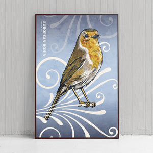 Bold graphic giclée art print of a European Robin. Print is a portrait of a European Robin perched atop a beautiful graphic ornament on a blue background with the words “European Robin” in the upper left corner.