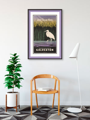 A retro style giclée art print of an Egret in a marsh in Galveston Island State Park. It has the words “Wade Through Nature” at the top. The print primarily is in bold black with bright colors. There are additional words a the bottom that says “Galveston Island State Park, Galveston”.