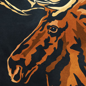 Detail of Bold graphic giclée art print of a North American Moose. Print shows a North American Moose blending into a dark gray Bluegreen background and overlapping the words “North America”.