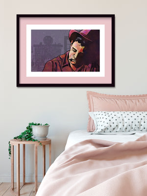 Modern style giclée art print of a cowboy smoking a cigarette in a cabin. It is richly colored, yet has gritty texture overall. There is a fireplace with mantle in the background.