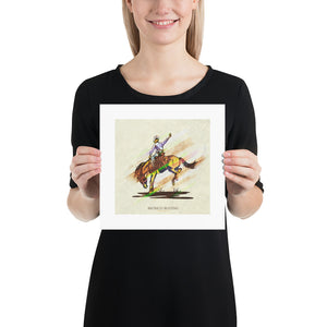 Retro styled art print of Bronco Busting. The prints depicts a cowboy riding a bronco. The bold graphic lines are complemented by colorful streaks giving the piece a sense of movement. The print has the words “Bronco Busting” on it. Size 10"x10".
