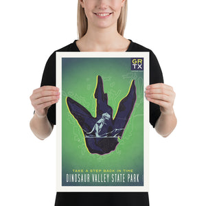 Bold graphic giclée art print of a Dinosaur foot print with T-rex inside and the words “Take a Step Back in Time. Dinosaur Valley State Park”. Print is predominately yellow green with deep purple accents. Size 12" x 18"