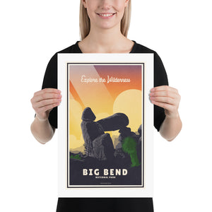 A retro style giclée art print of Balance Rock at Big Bend National Park in Texas. It has the words “Explore the Wilderness” at the top. The print primarily is in bold navy blue with bright sunset colors. There are additional words a the bottom that says “Big Bend National Park”. Size 12" x 18"