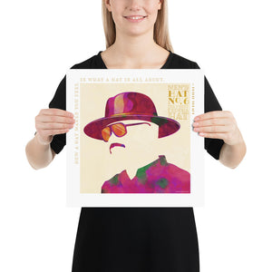 Colorful portrait of a funky fedora hat with a quote from London milliner Philip Treacy — “How a hat makes you feel is what a hat is all about.” Bold graphic shapes in bright colors combined with sophisticated typography and intriguing negative space creates a compelling art piece. Size 14" x 14"