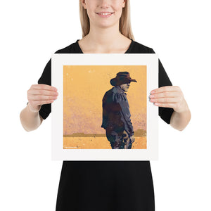 Modern style giclée art print of a western gunslinger. It features dusty sunset colors and gritty texture with a minimalist western landscape in the background. Size 14" x 14"