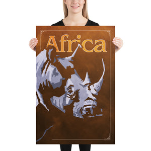 Bold graphic giclée art print of an African Rhinoceros. Print shows an African Rhino blending into a dark background and overlapping the word “Africa”. Size of 24" x 36"